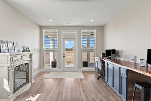 a kitchen with a refrigerator and a stove top oven
