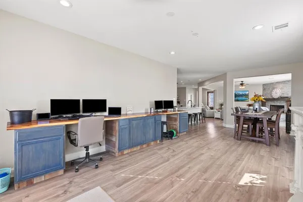 a workspace with furniture and wooden floor