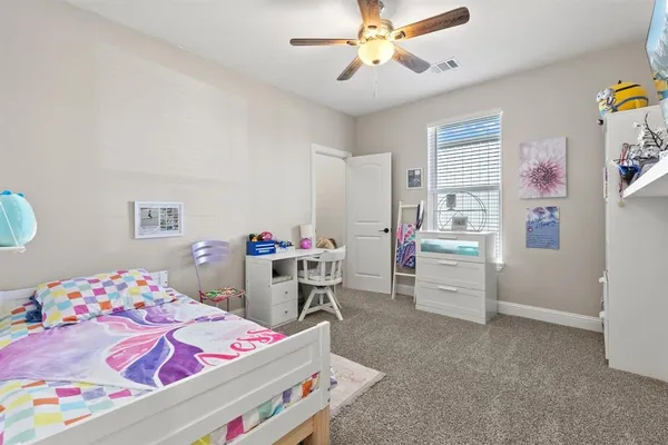 a bedroom with a bed and furniture