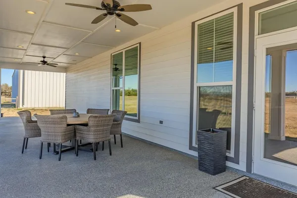 a view of a dining room with furniture and window