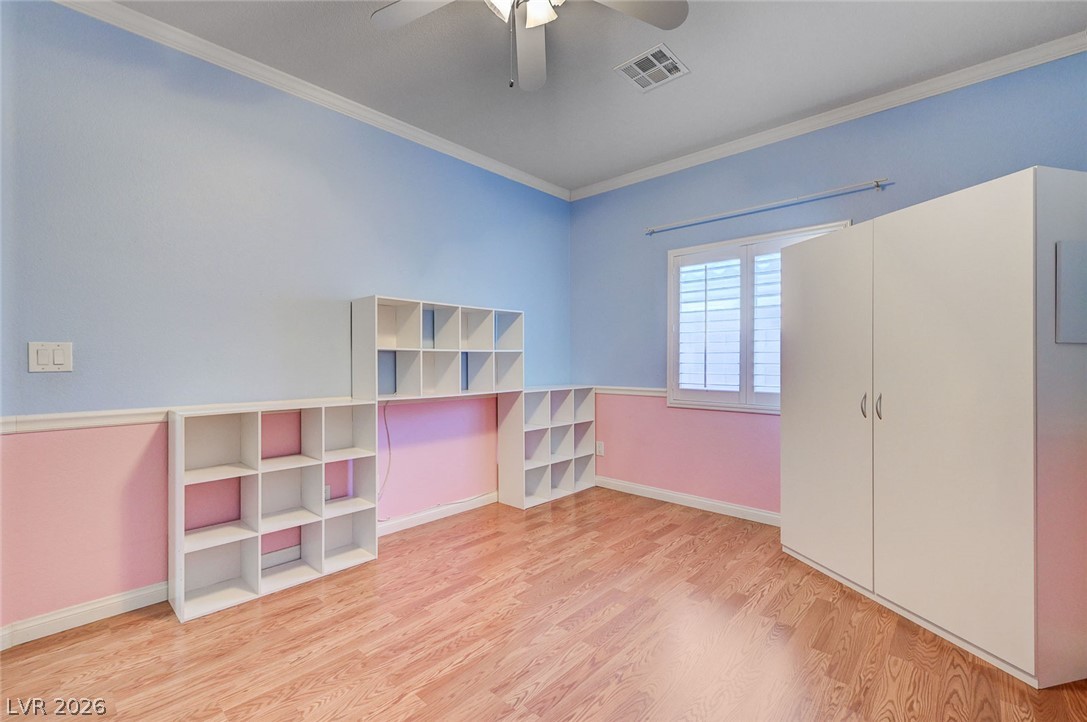 1604 Cattle Ranch Place Henderson, NV 89002 - Photo 59 of 99 Hardwood floors and built-in shelving create a functional and adaptable interior space.