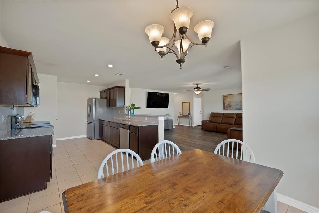 7450 Briar Road Azle, TX 76020 - Photo 17 of 40 a view of a dining room with furniture
