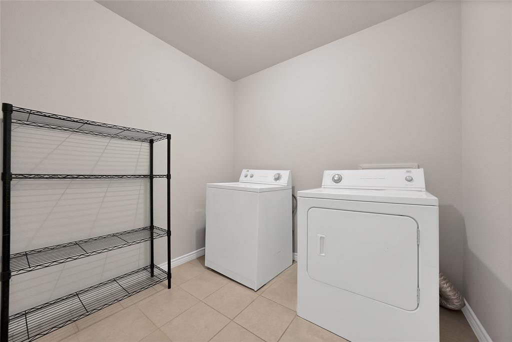 7450 Briar Road Azle, TX 76020 - Photo 25 of 40 a utility room with dryer and washer