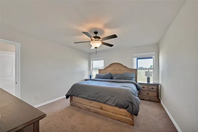 a bedroom with a bed and window