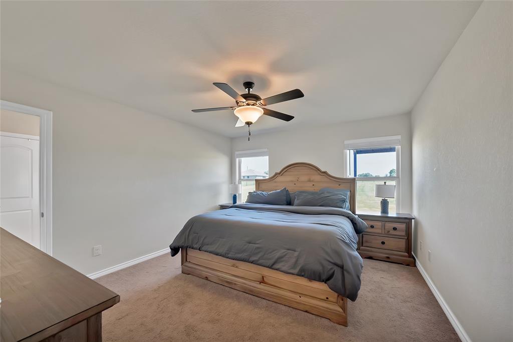 7450 Briar Road Azle, TX 76020 - Photo 32 of 40 a bedroom with a bed and window