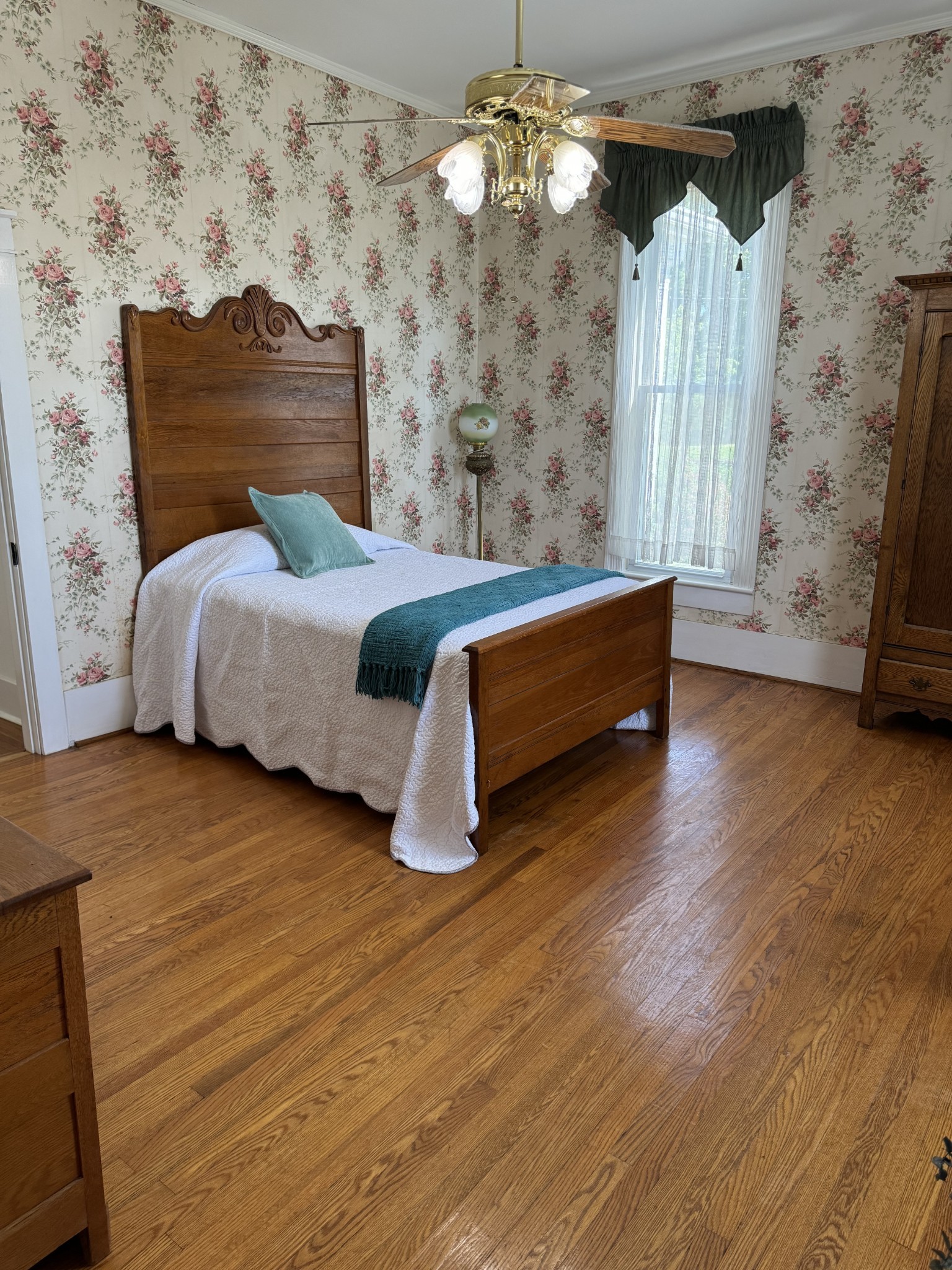 618 Main Street North Carthage, TN 37030 - Photo 33 of 65 a spacious bedroom with a bed and a chandelier