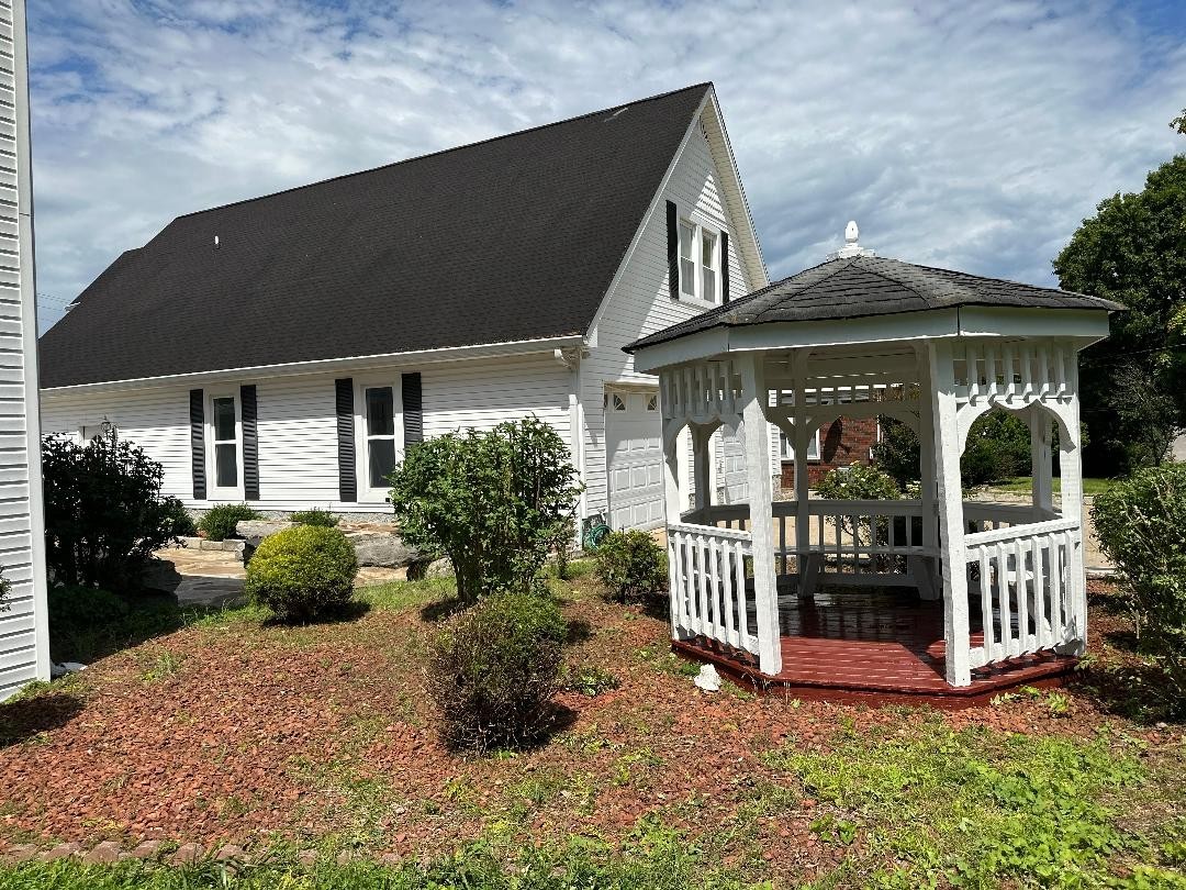 618 Main Street North Carthage, TN 37030 - Photo 7 of 65 a front view of a house with porch