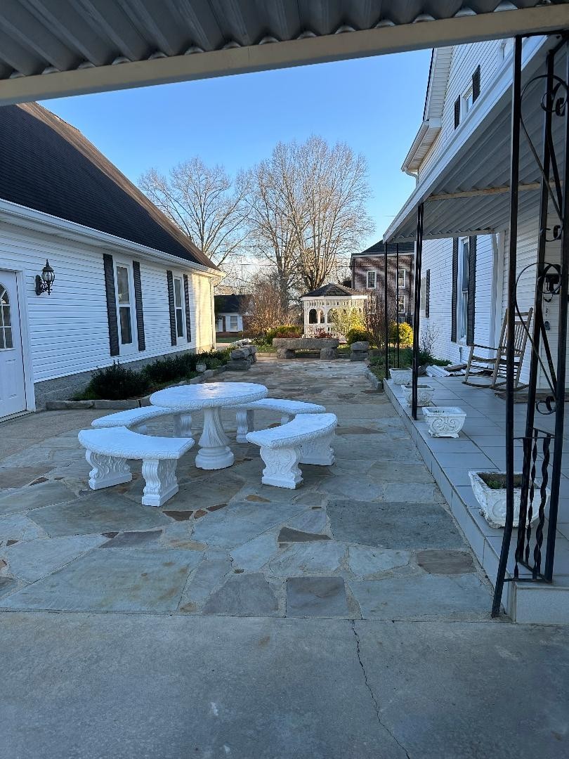 618 Main Street North Carthage, TN 37030 - Photo 9 of 65 a view of a patio with table and chairs with wooden floor