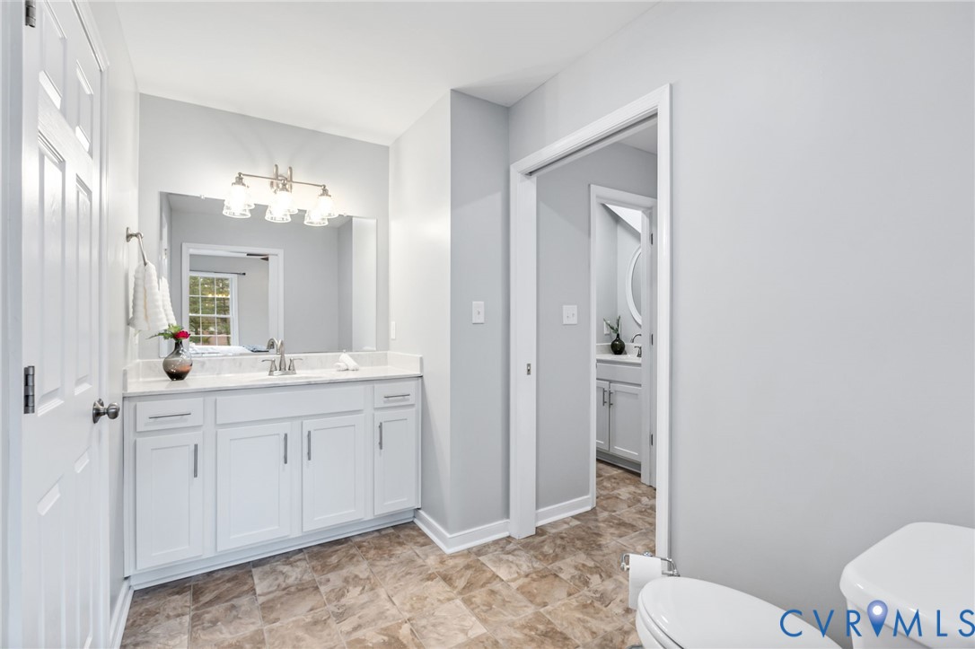 3200 Ludgate Road Chester, VA 23831 - Photo 14 of 33 a spacious bathroom with a toilet sink and mirror