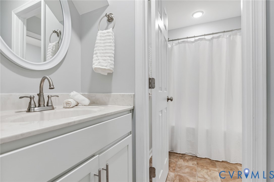 3200 Ludgate Road Chester, VA 23831 - Photo 16 of 33 a bathroom with a sink and a mirror