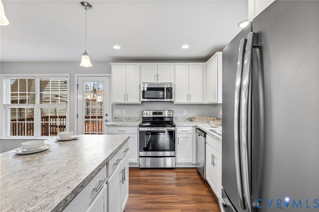 3200 Ludgate Road Chester, VA 23831 - Photo 8 of 33 a kitchen with granite countertop stainless steel appliances and wooden cabinets