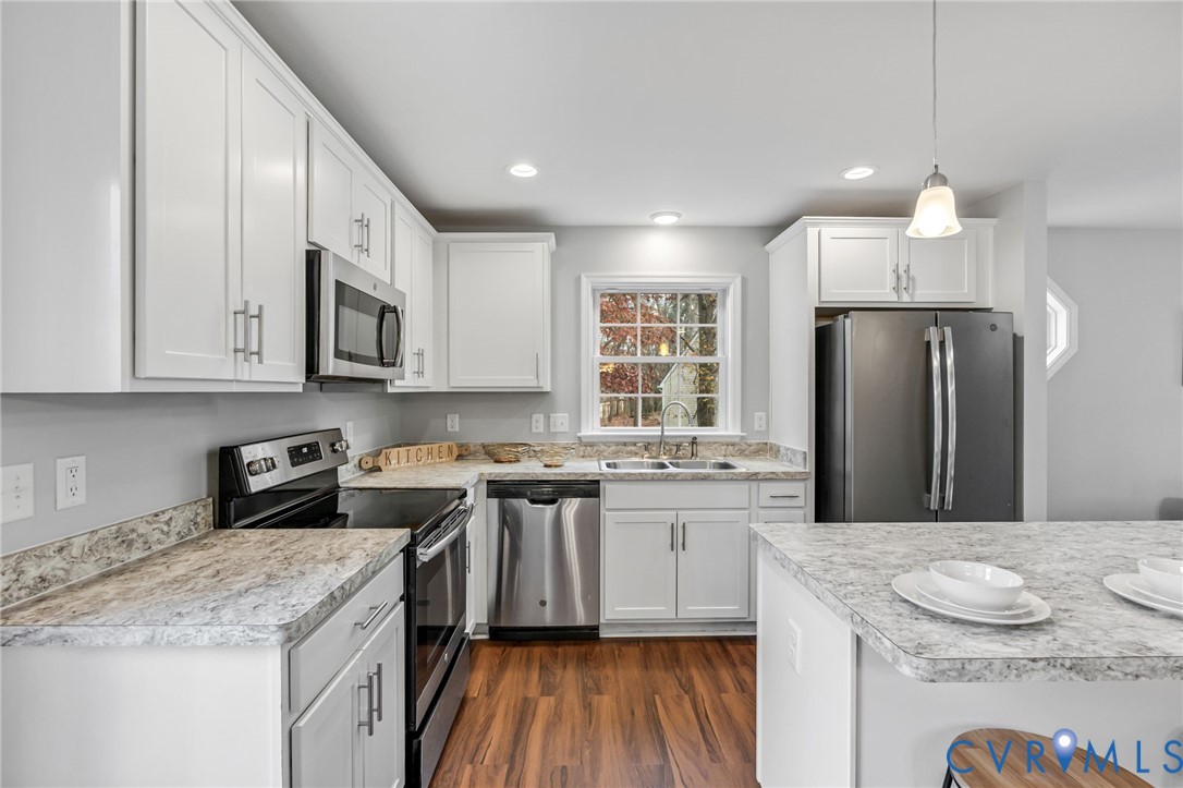 3200 Ludgate Road Chester, VA 23831 - Photo 10 of 33 a kitchen with stainless steel appliances granite countertop a sink stove refrigerator and cabinets