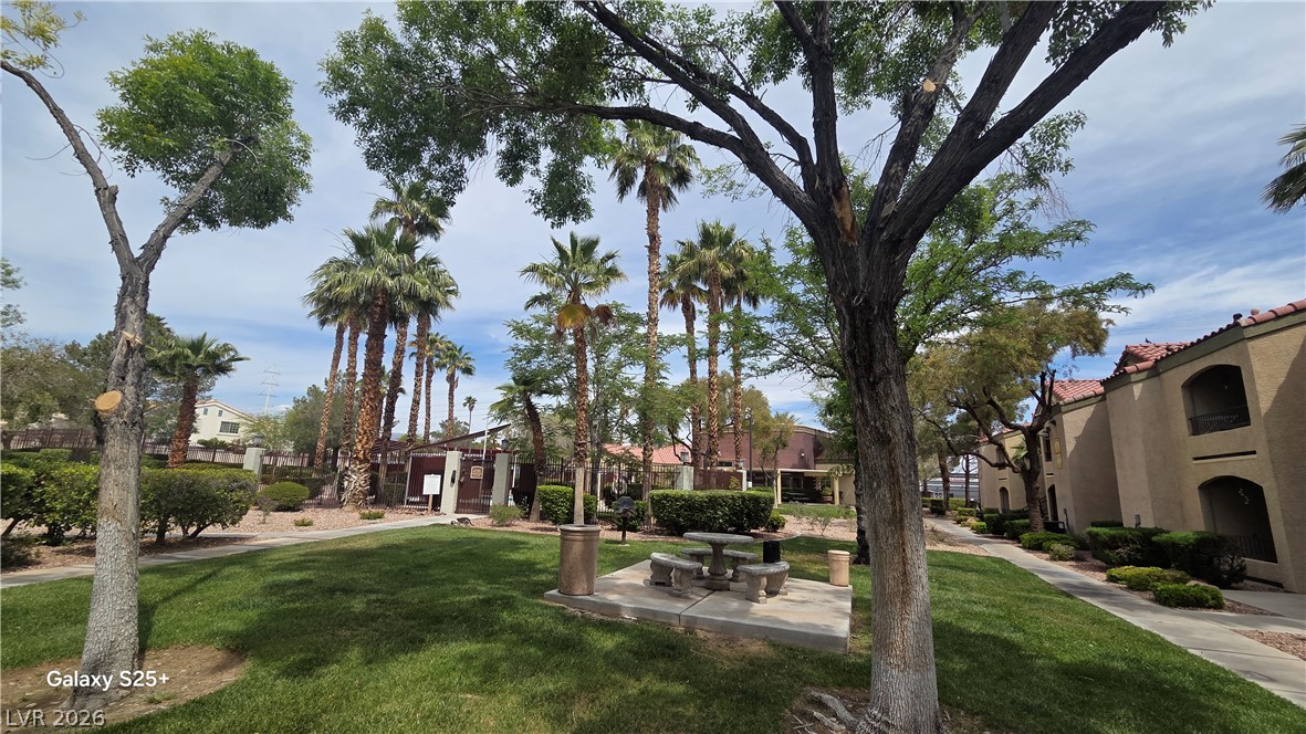 7885 West Flamingo Road, Unit 1008 Las Vegas, NV 89147 - Photo 28 of 29 Green spaces and pathways weave through this charming community with Mediterranean-inspired architecture.