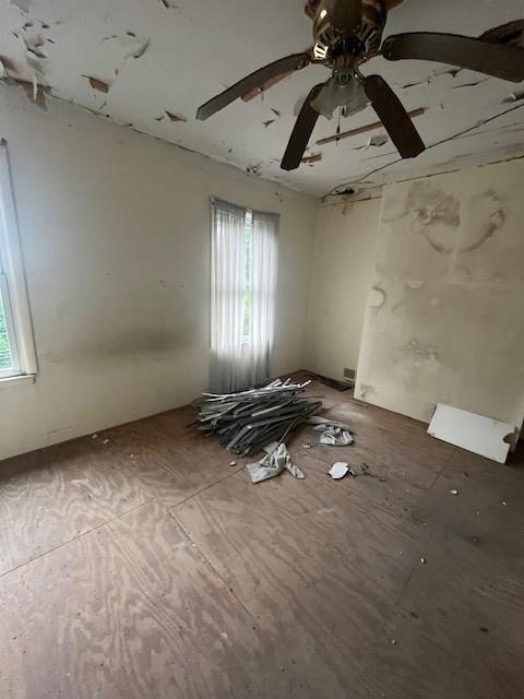 5104 Verona Road Verona, PA 15147 - Photo 13 of 20 an empty room with windows and ceiling fan view