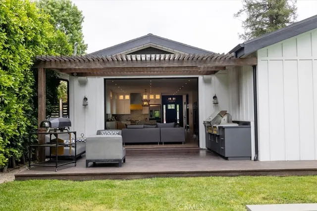 a view of a house with couches and a patio