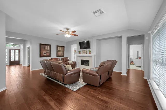 a living room with furniture and a fireplace