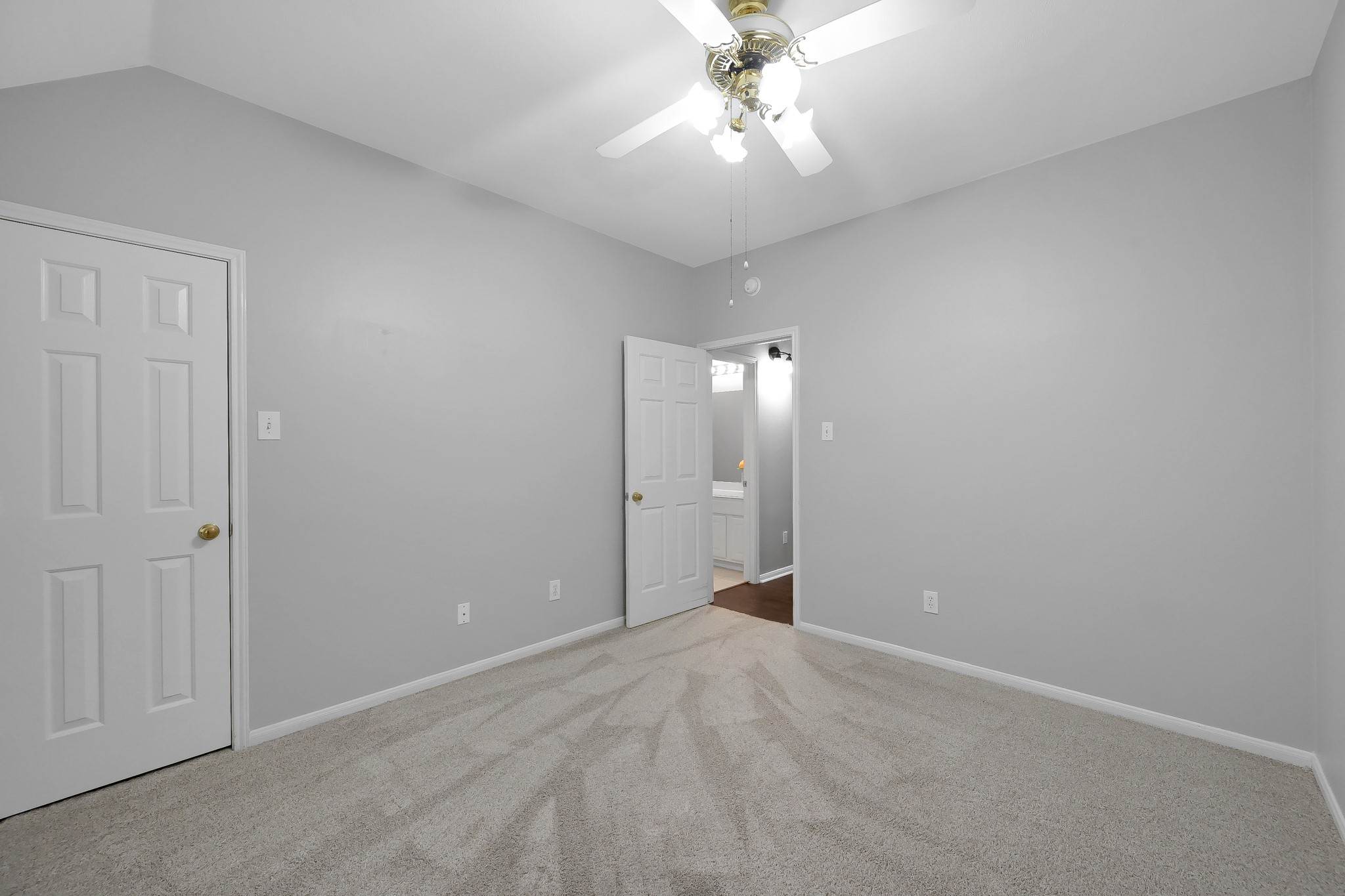 20251 Eden Pines Spring, TX 77379 - Photo 19 of 33 a view of an empty room with a chandelier fan
