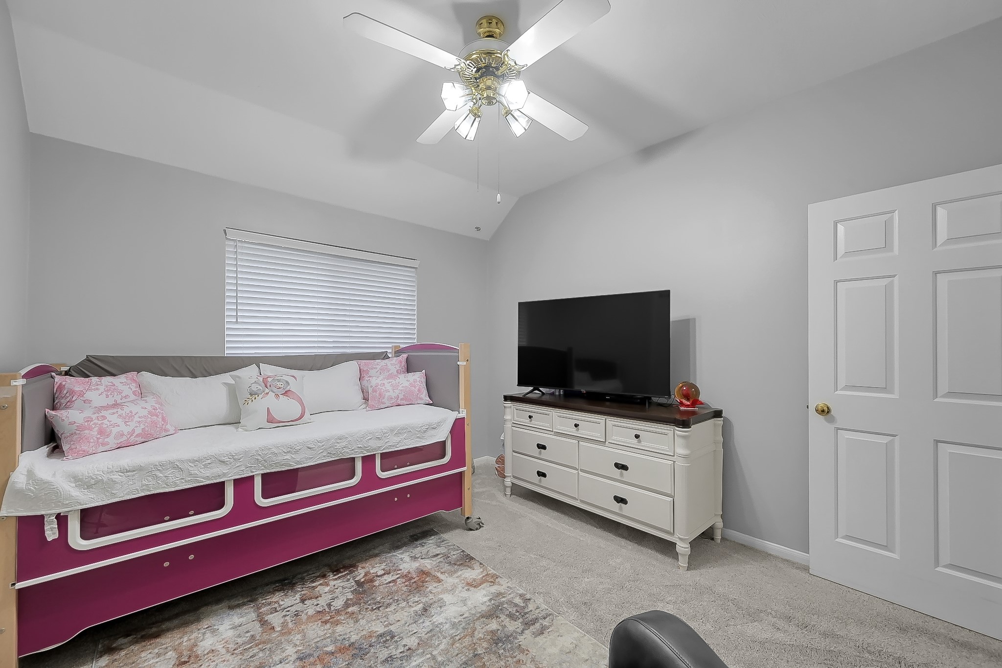 20251 Eden Pines Spring, TX 77379 - Photo 20 of 33 a living room with furniture and a flat screen tv