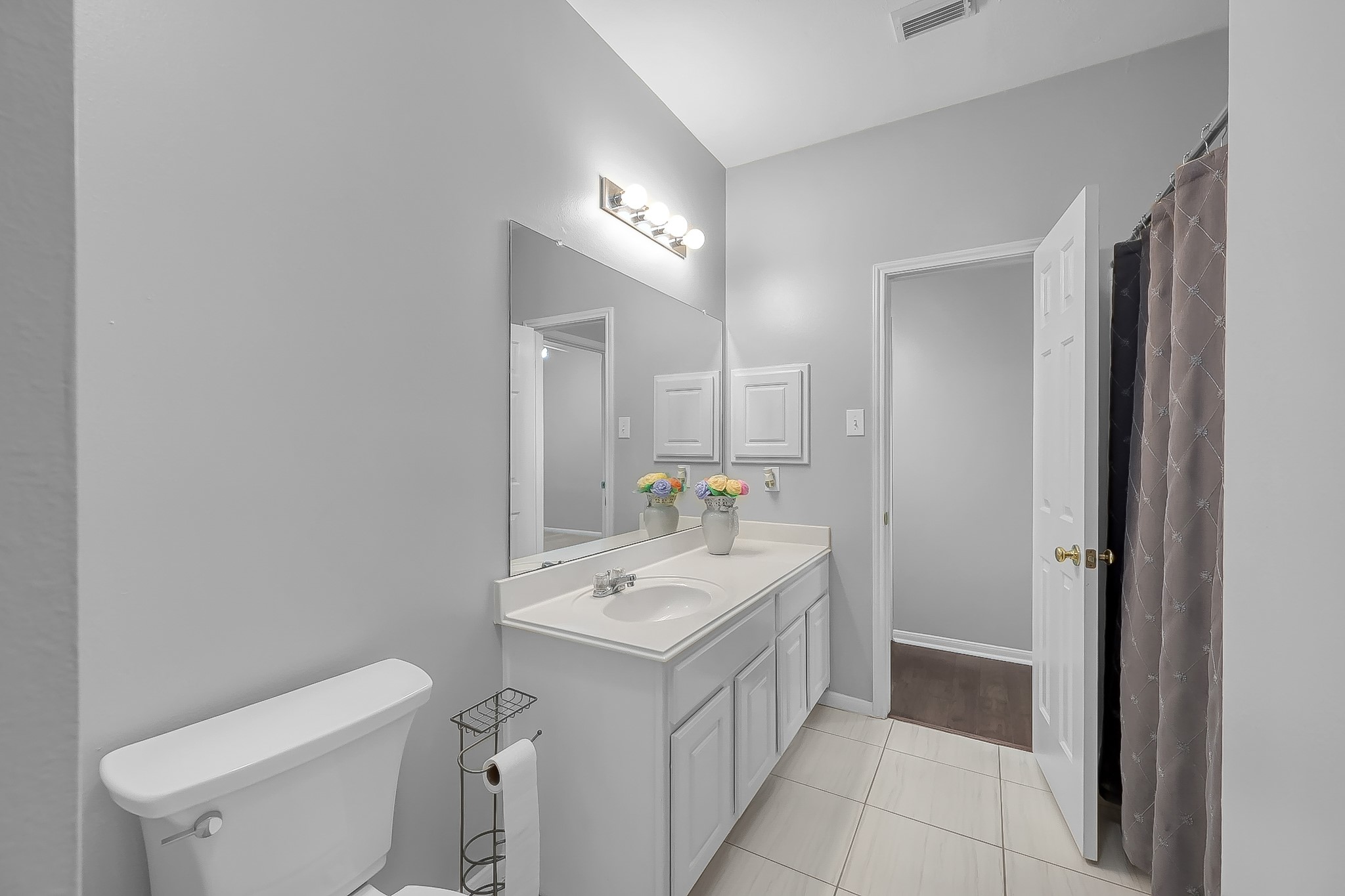 20251 Eden Pines Spring, TX 77379 - Photo 21 of 33 a bathroom with a sink toilet and mirror