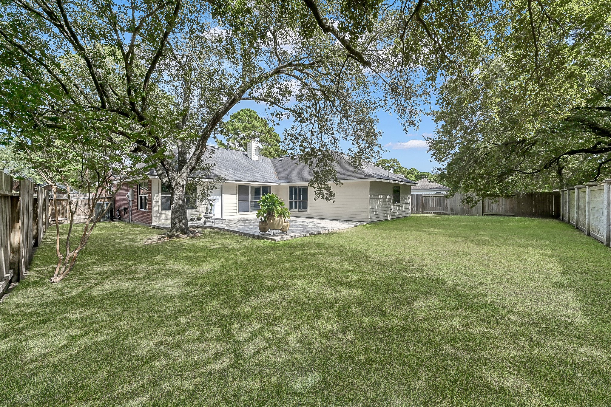 20251 Eden Pines Spring, TX 77379 - Photo 26 of 33 a front view of house with yard and green space