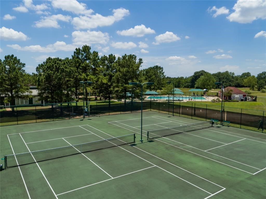 20251 Eden Pines Spring, TX 77379 - Photo 30 of 33 a view of a tennis court