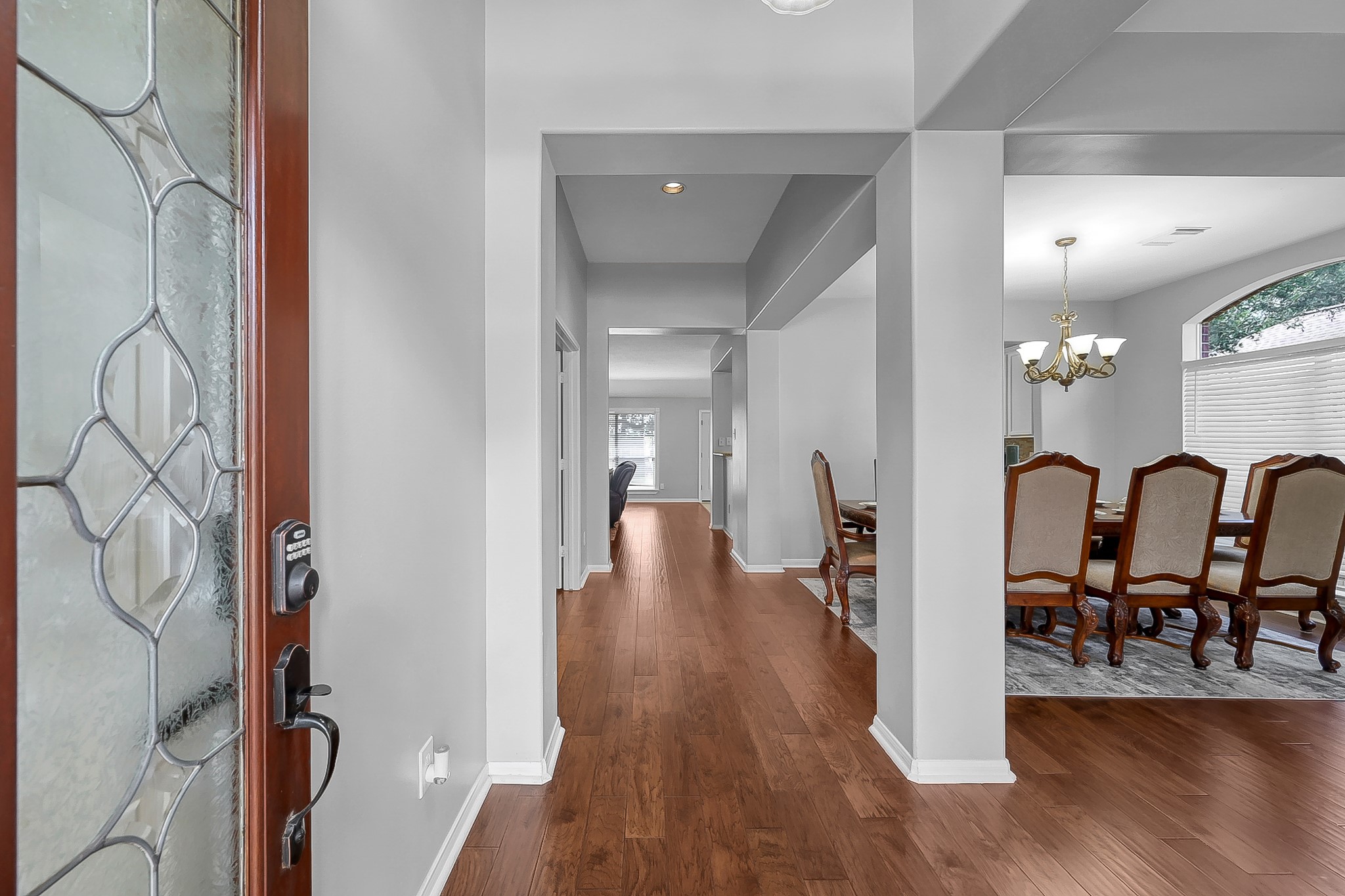 20251 Eden Pines Spring, TX 77379 - Photo 3 of 33 a view of a lobby with furniture and wooden floor