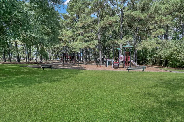 a view of a park with swings and slides