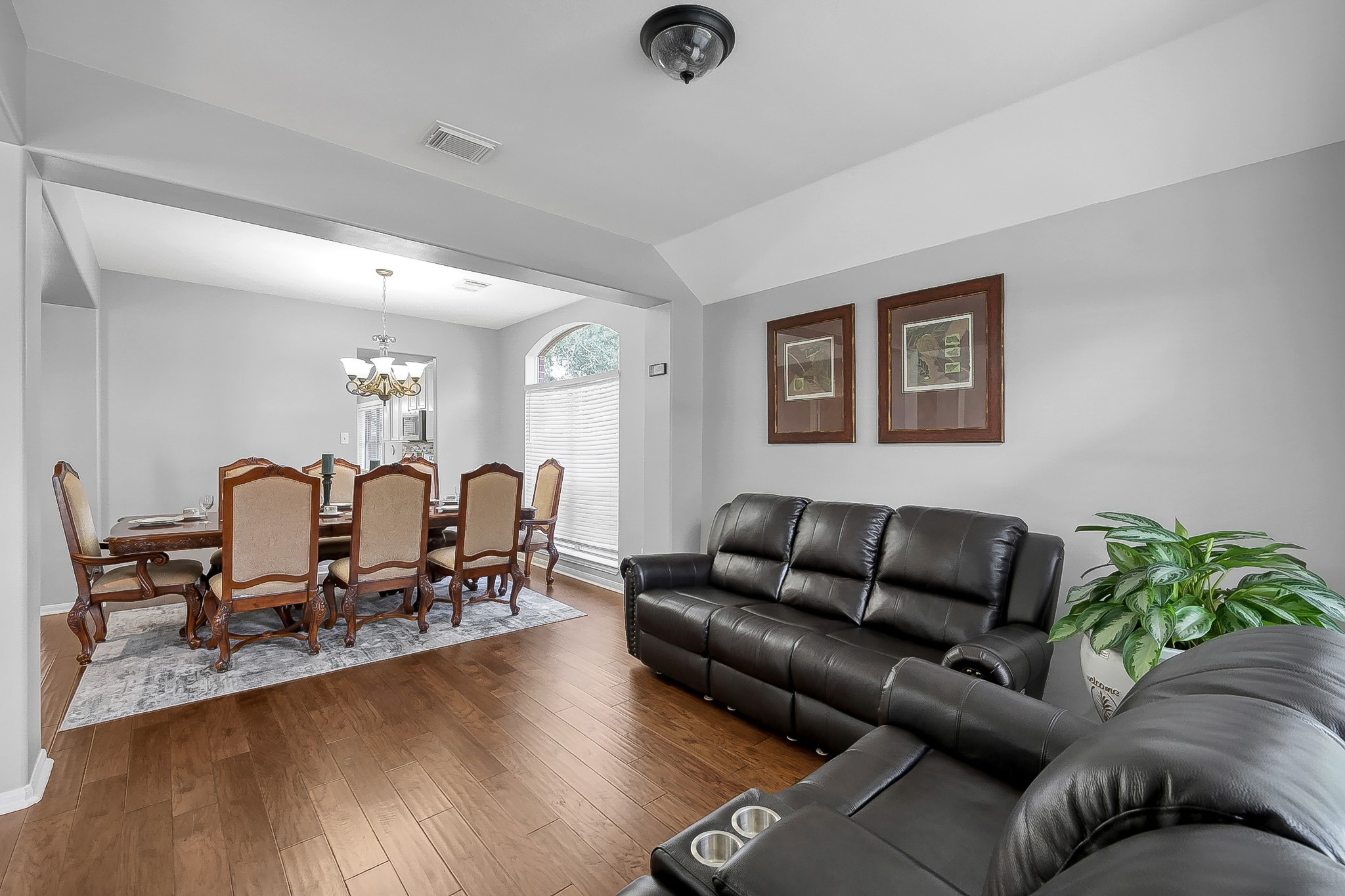 20251 Eden Pines Spring, TX 77379 - Photo 6 of 33 a living room with furniture and wooden floor