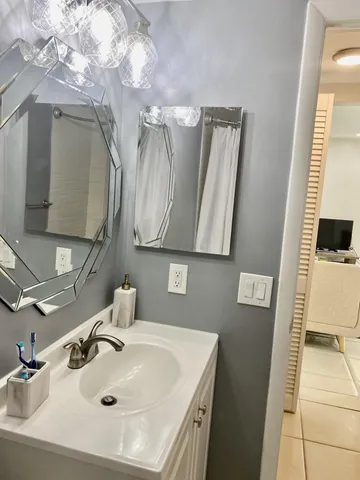 a bathroom with a sink and a mirror