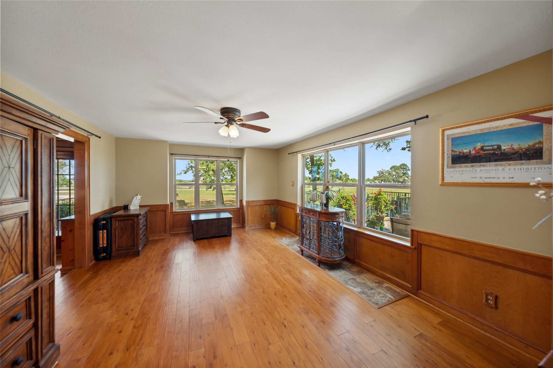 25948 Nelson Road Hempstead, TX 77445 - Photo 18 of 46 Spacious formal dining room featuring hardwood flooring, crown molding, ceiling fan, and generous space for entertaining.