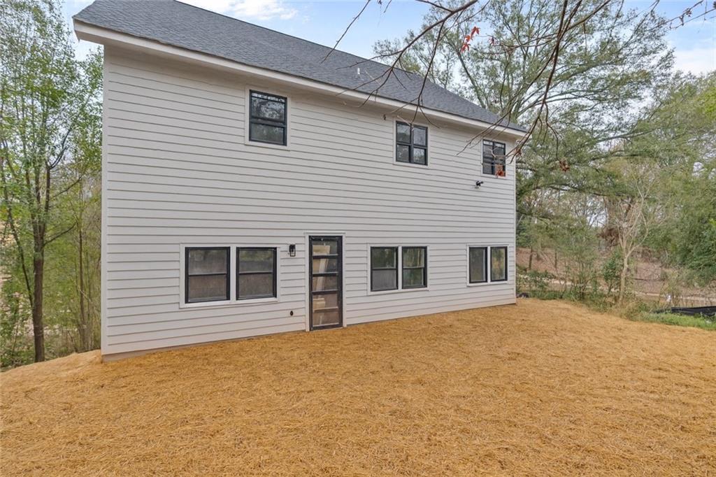 2659 Flat Shoals Road Decatur, GA 30034 - Photo 19 of 20 a front view of a house with a yard and garage