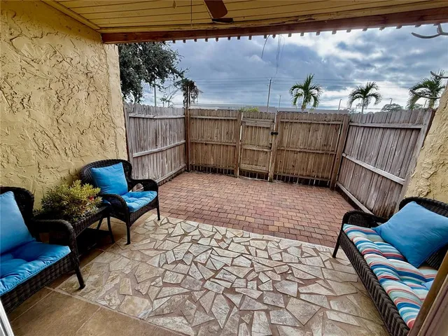 a view of a lounge chairs in the patio