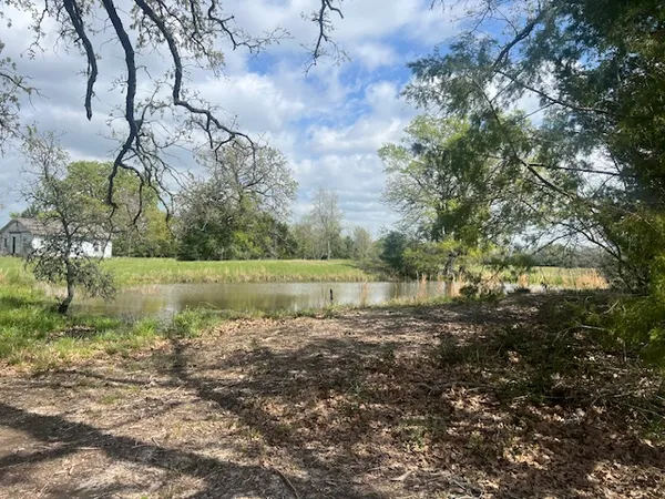 a view of a lake with a yard