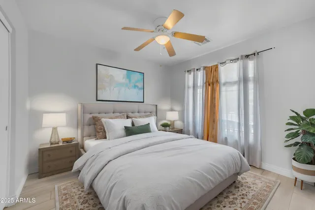 a bedroom with a bed and dresser