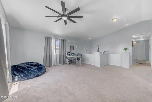 a view of multiple houses with a yard