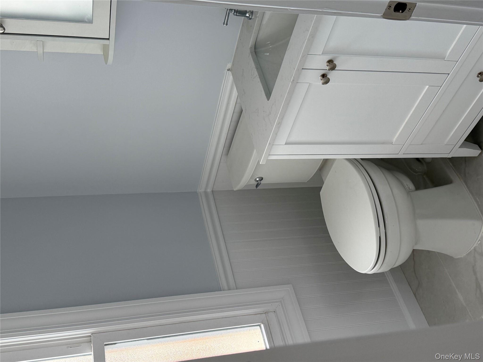 107-31 121st Street Queens, NY 11419 - Photo 11 of 20 a bathroom with a toilet and a shower