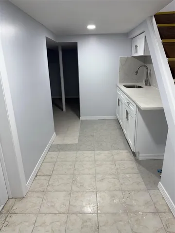 a view of a kitchen with a sink and dishwasher
