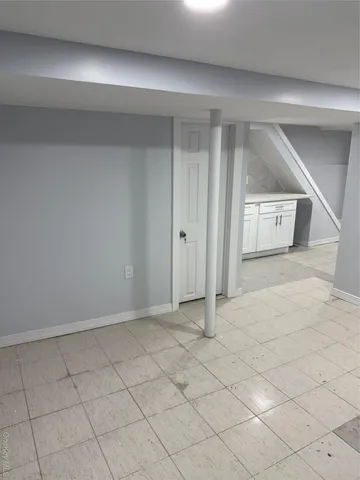 en empty room with a fireplace