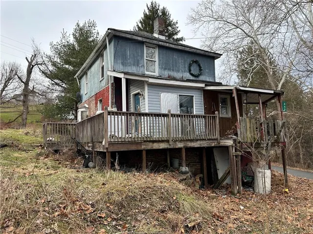 a backyard of a house with lots of green space