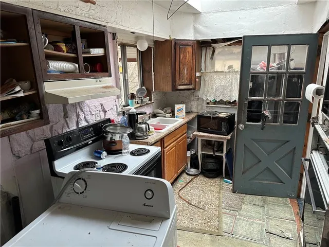 a kitchen with a stove and cabinets