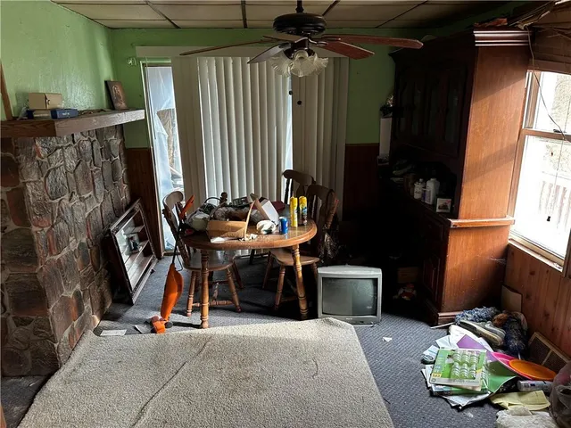 a room with a mirror and furniture