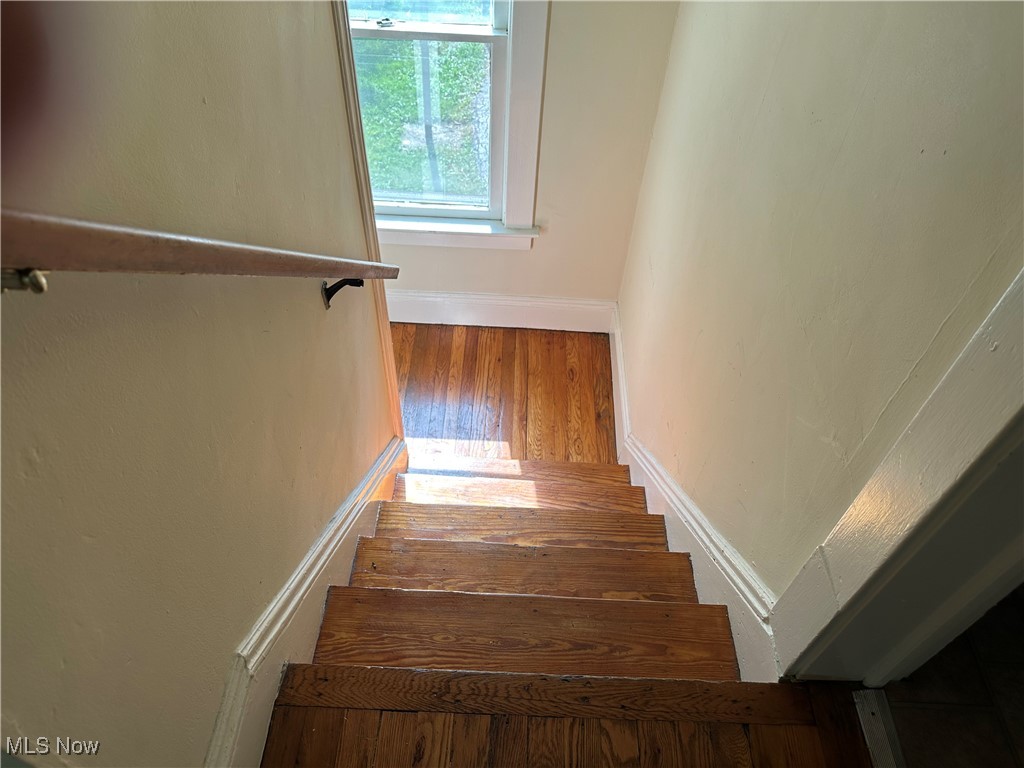 1596 Wood Road Cleveland Heights, OH 44121 - Photo 10 of 25 Staircase with baseboards and wood finished floors