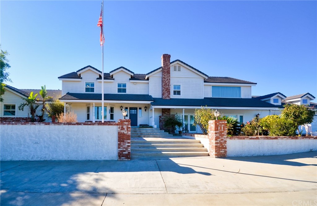 18515 Halter Lane Riverside, CA 92504 - Photo 1 of 1 a front view of a house with a garden