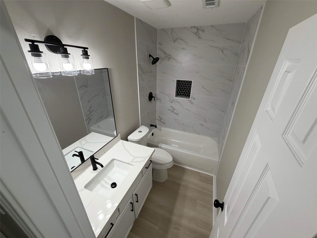 2006 Kilgore Road, Unit 101 Baytown, TX 77520 - Photo 6 of 9 a bathroom with a bathtub sink and mirror