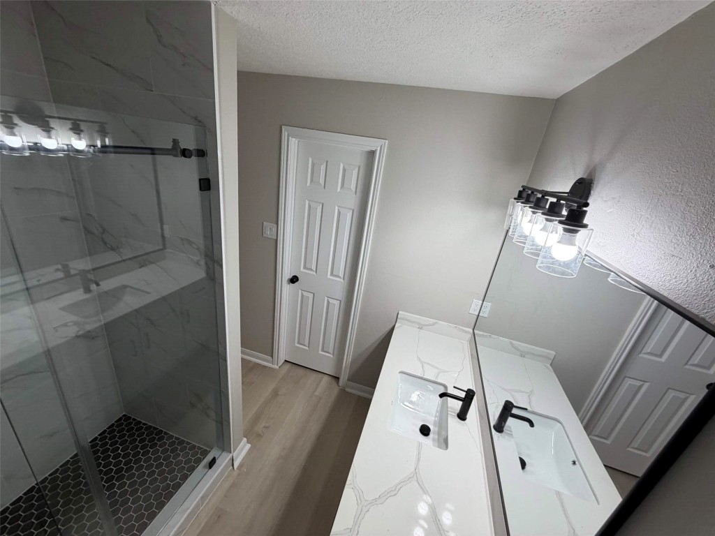 2006 Kilgore Road, Unit 101 Baytown, TX 77520 - Photo 7 of 9 a bathroom with a sink and shower