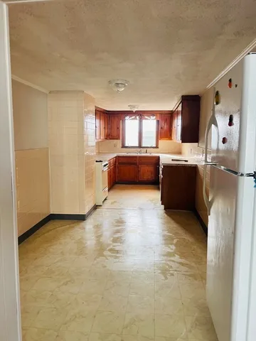 a view of a kitchen with furniture and window