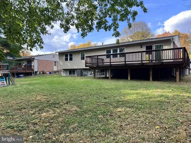 a house that has a big yard and large trees