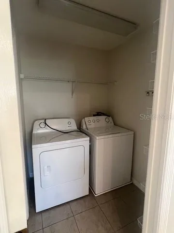 a view of green field with house in background