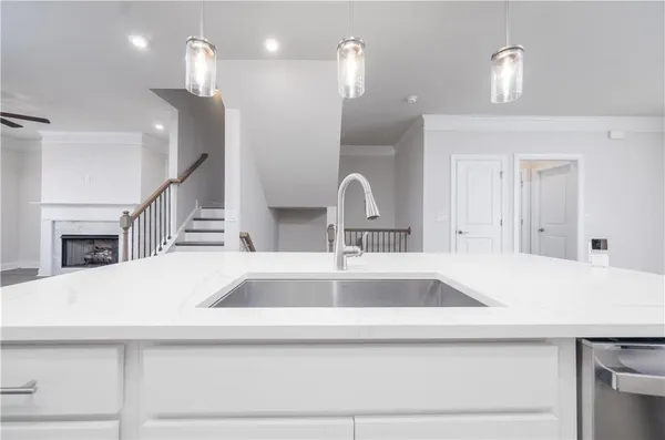 a kitchen with a sink and a refrigerator