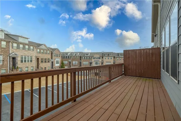 a view of a balcony with wooden floor
